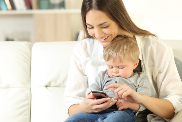 Mom and son reading emails on phone