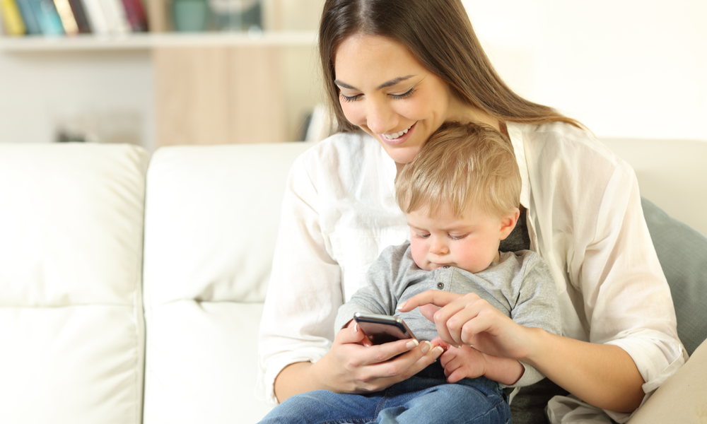 Mom and son reading emails on phone