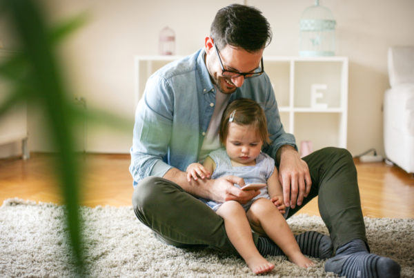 Parent researching parenting on mobile device