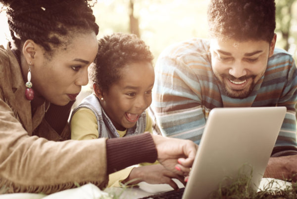 Family using computer to view childcare center website