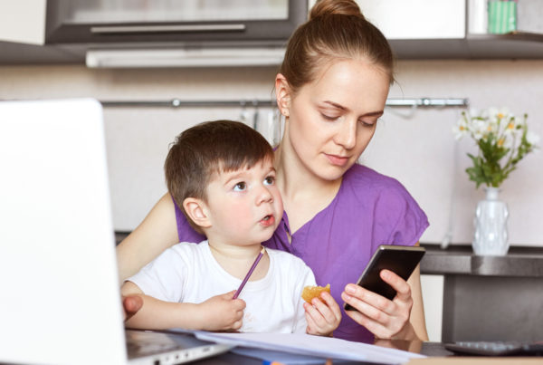 working mom on smartphone