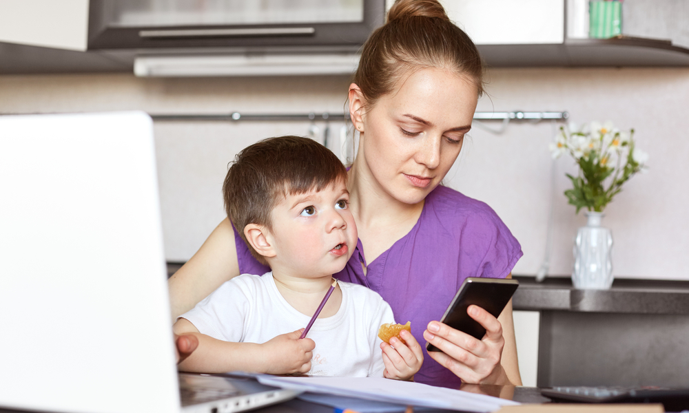 working mom on smartphone