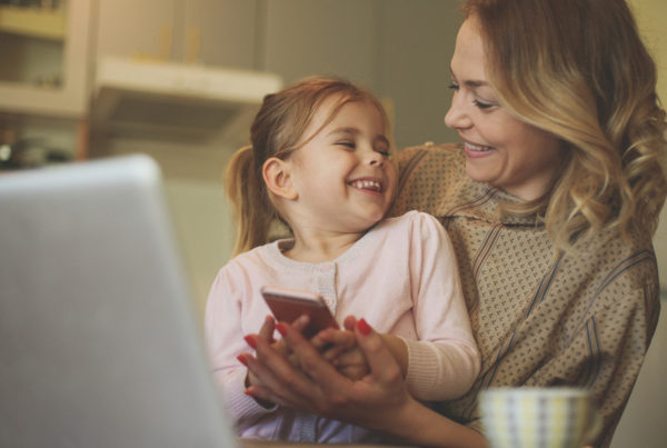 Mother and daughter looking at phone