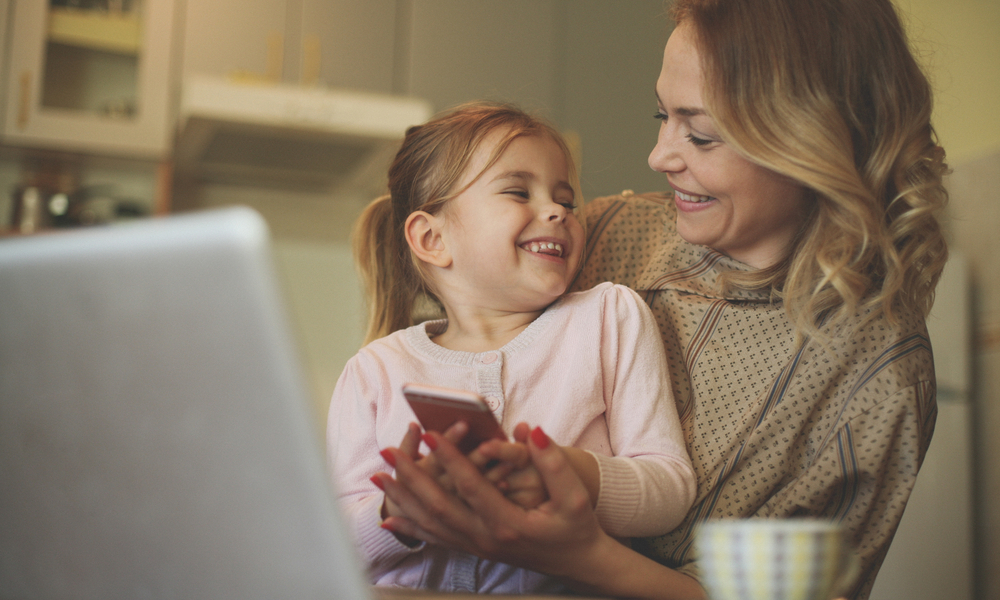 Mother and daughter looking at phone