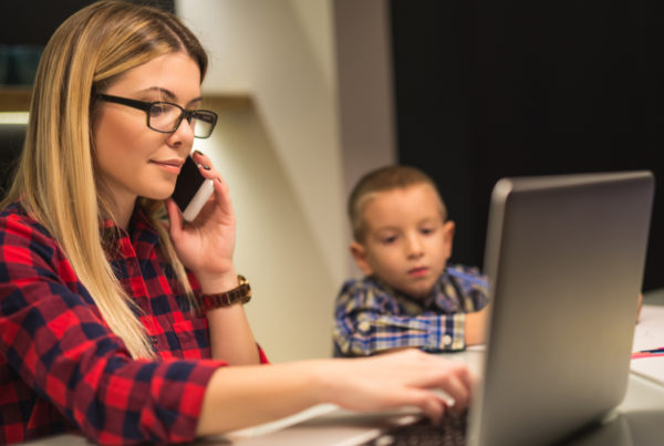 Mom on computer and phone