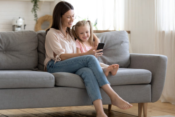 Mother and daughter looking at phone