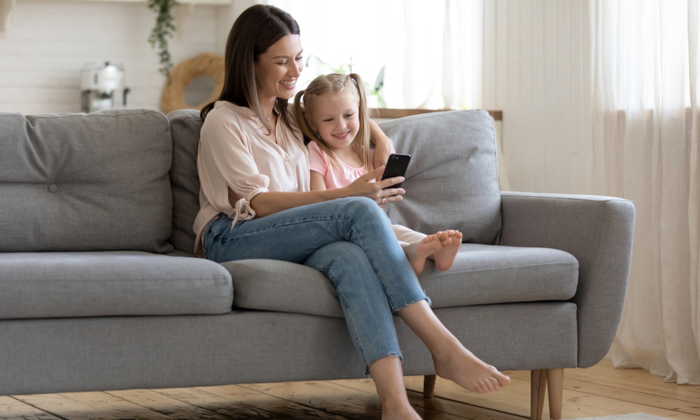 Mother and daughter looking at phone